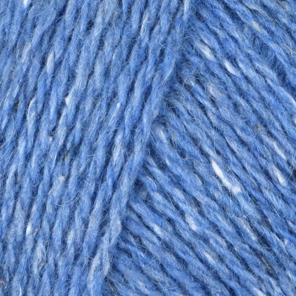 Ciel 215: A heathered tweed yarn in a sky blue color with flecks of  and white.
