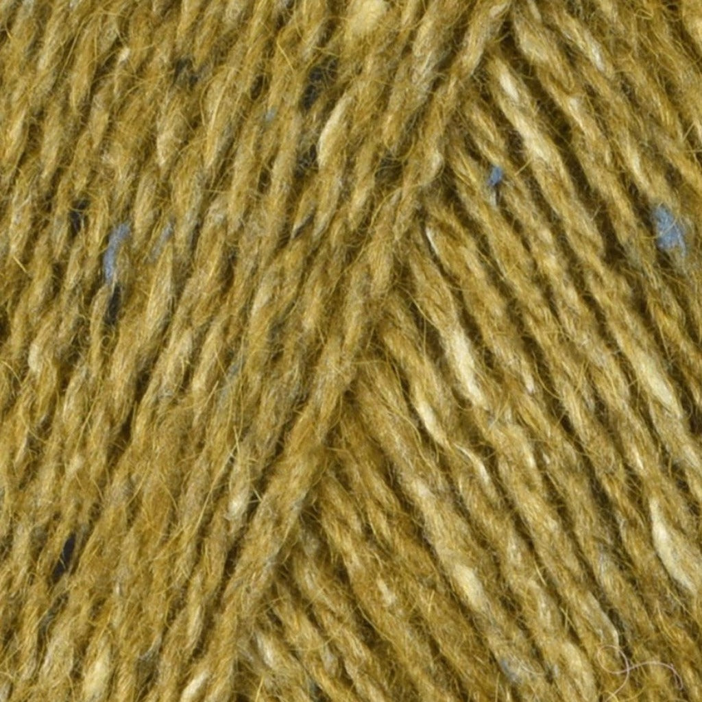 French Mustard 216: A heathered tweed yarn in a dijon mustard color with flecks of blue and white.