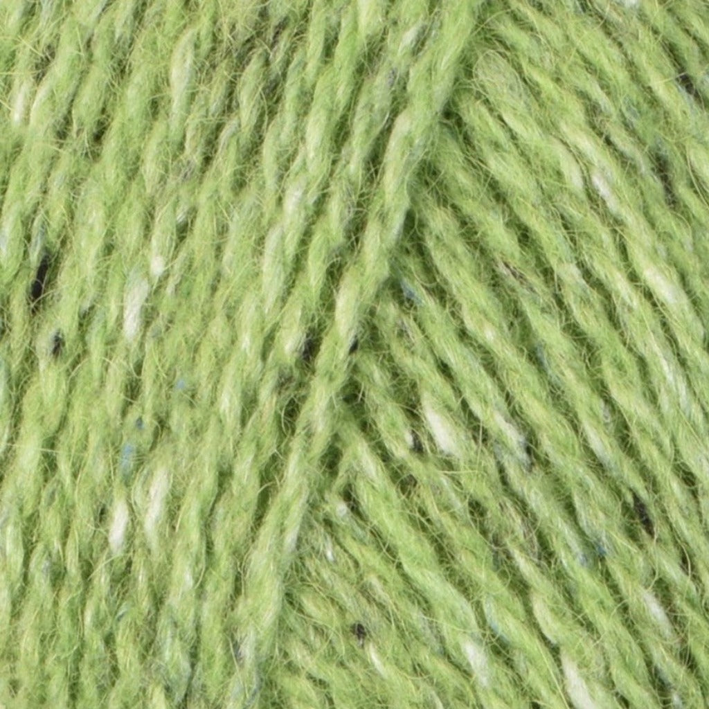 Lime 213: A heathered tweed yarn in a dusty lime green color with flecks of black, blue and white.