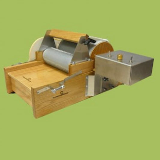Motorized drum carder machine for fiber preparation.