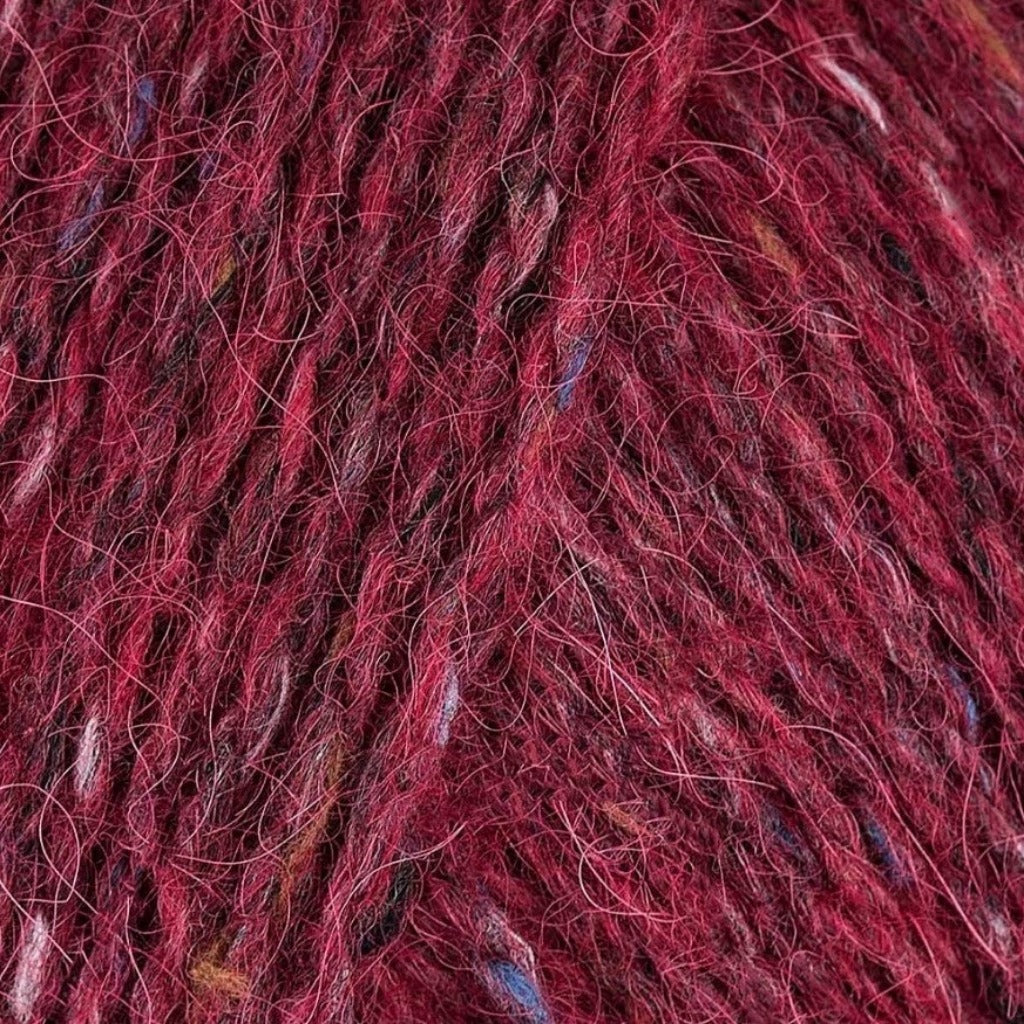Rage 150: A heathered tweed yarn in a deep ruby red color with flecks of tan and blue