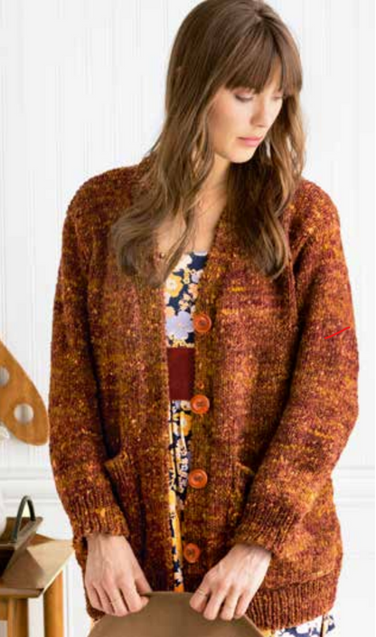 Woman wearing brown cardigan, screenshot from August 31, 2023.