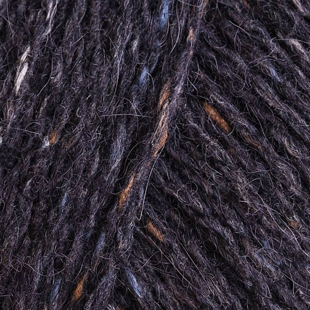 Seafarer 170: A heathered tweed yarn in a dark purple charcoal color with flecks of orange and white