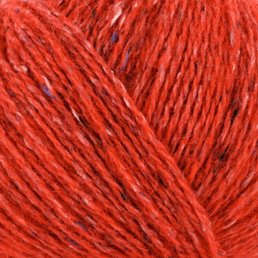 Zinnia 198: A heathered tweed yarn in a bright orange red color with flecks of blue and white.