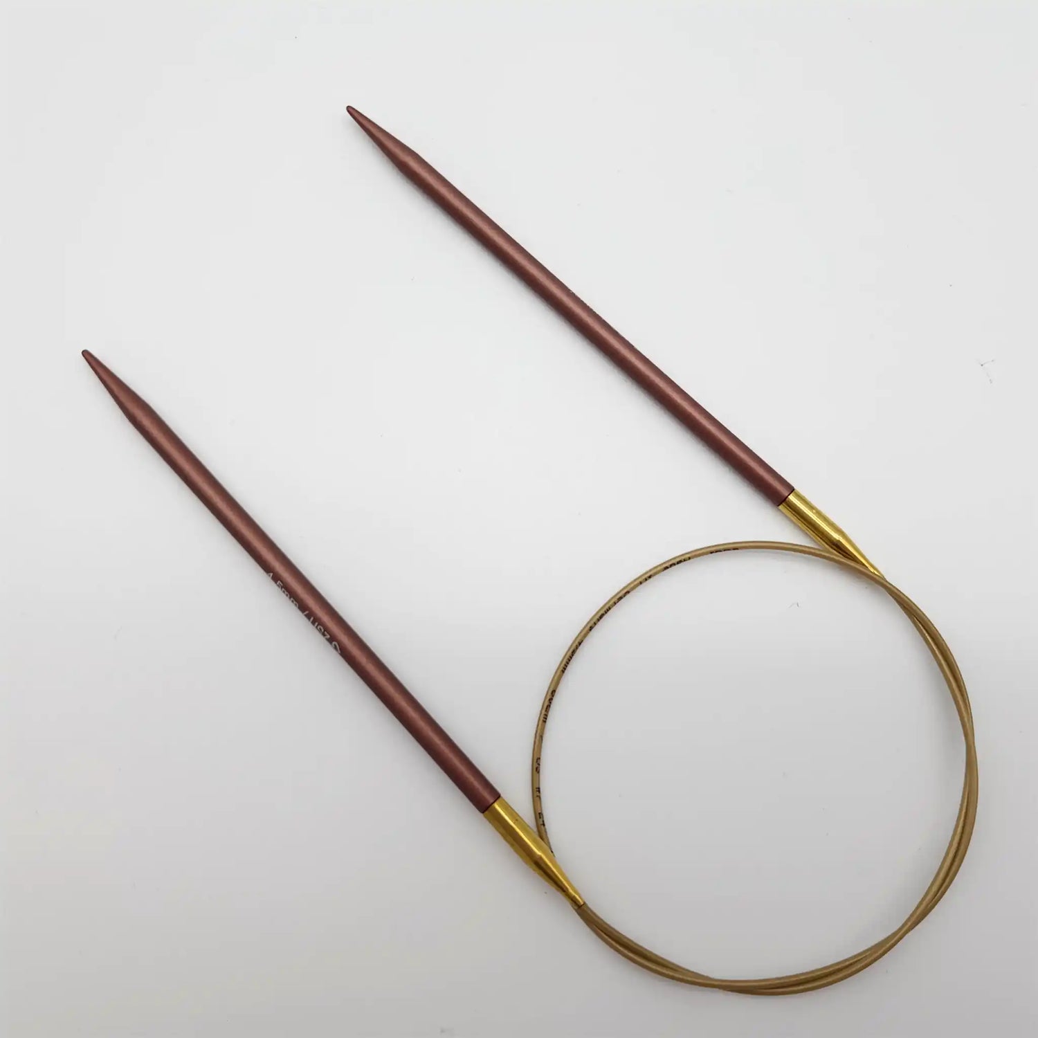 Addi 24in Mystic Rockets with tips and gold cables with brass ferrules on a white background
