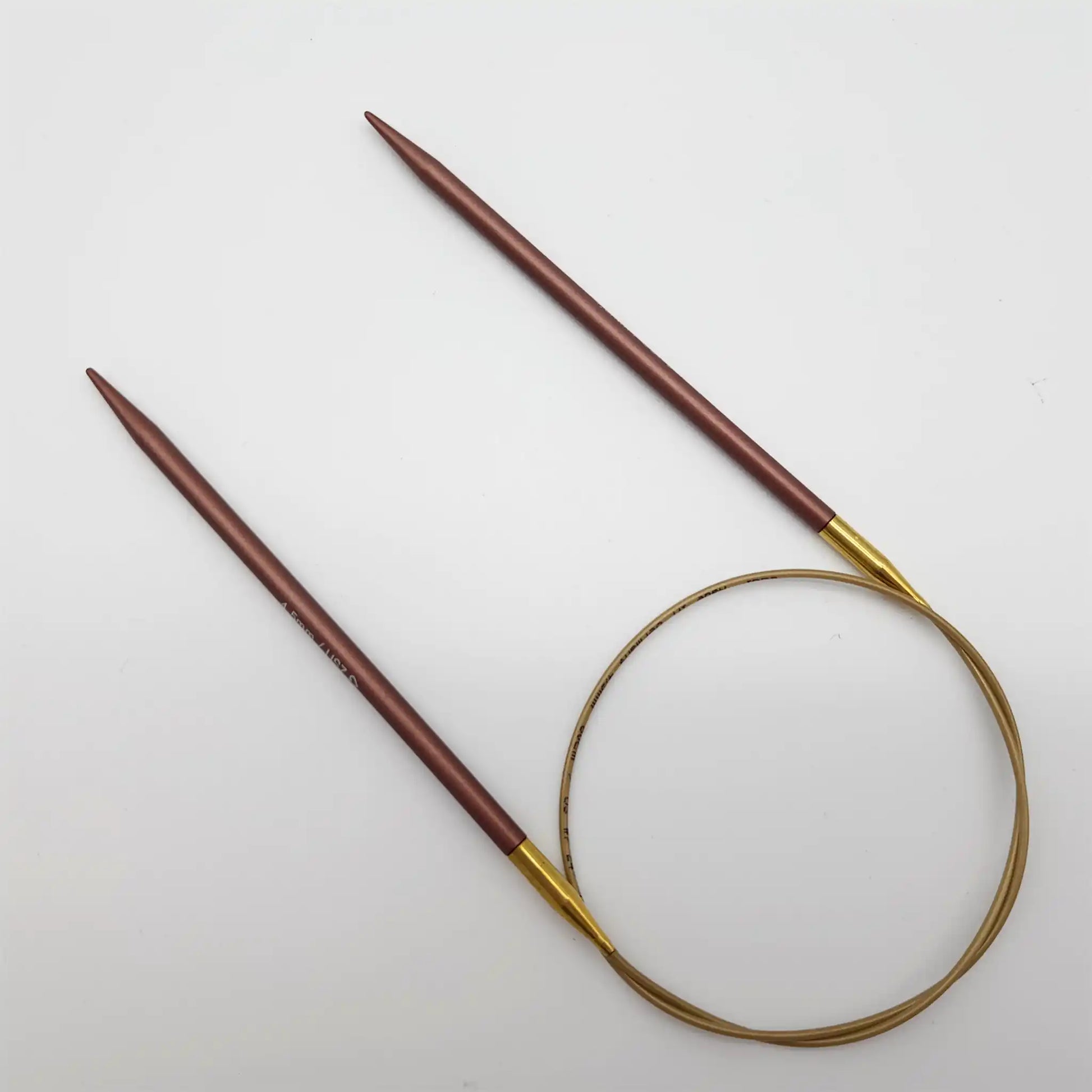 Addi 24in Mystic Rockets with tips and gold cables with brass ferrules on a white background