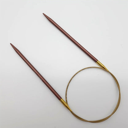 Addi 24in Mystic Rockets with tips and gold cables with brass ferrules on a white background
