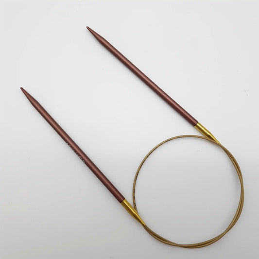 Addi 24in Mystic Rockets with tips and gold cables with brass ferrules on a white background