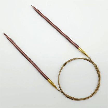 Addi 32in Mystic Rockets with tips and gold cables with brass ferrules on a white background