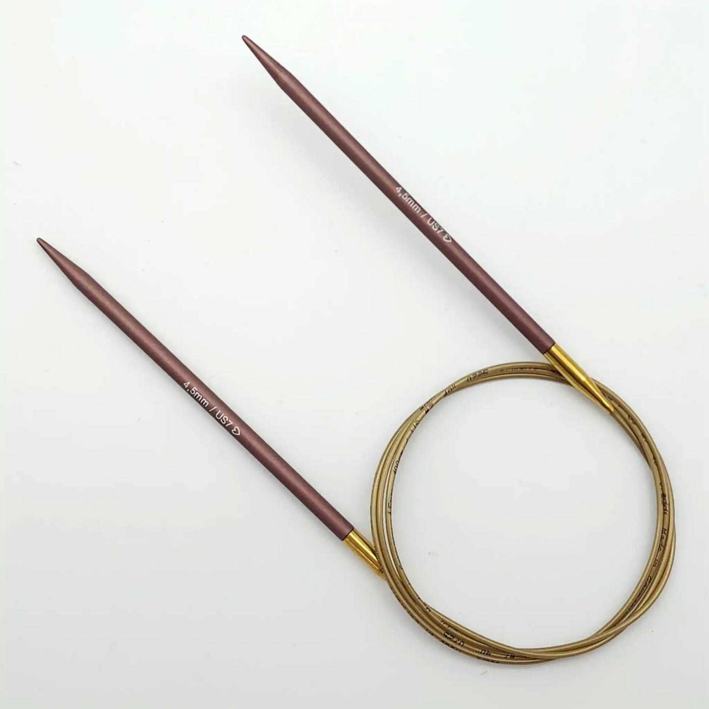 Addi 40in Mystic Rockets with tips and gold cables with brass ferrules on a white background