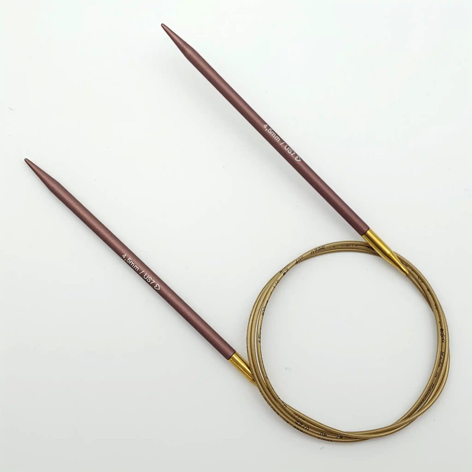 Addi 40in Mystic Rockets with tips and gold cables with brass ferrules on a white background