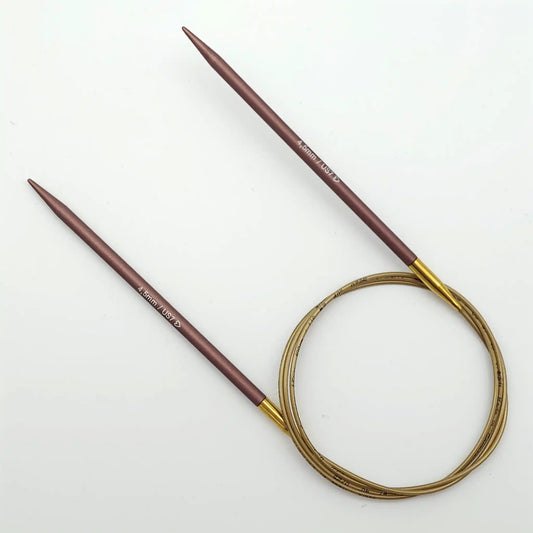Addi 40in Mystic Rockets with tips and gold cables with brass ferrules on a white background