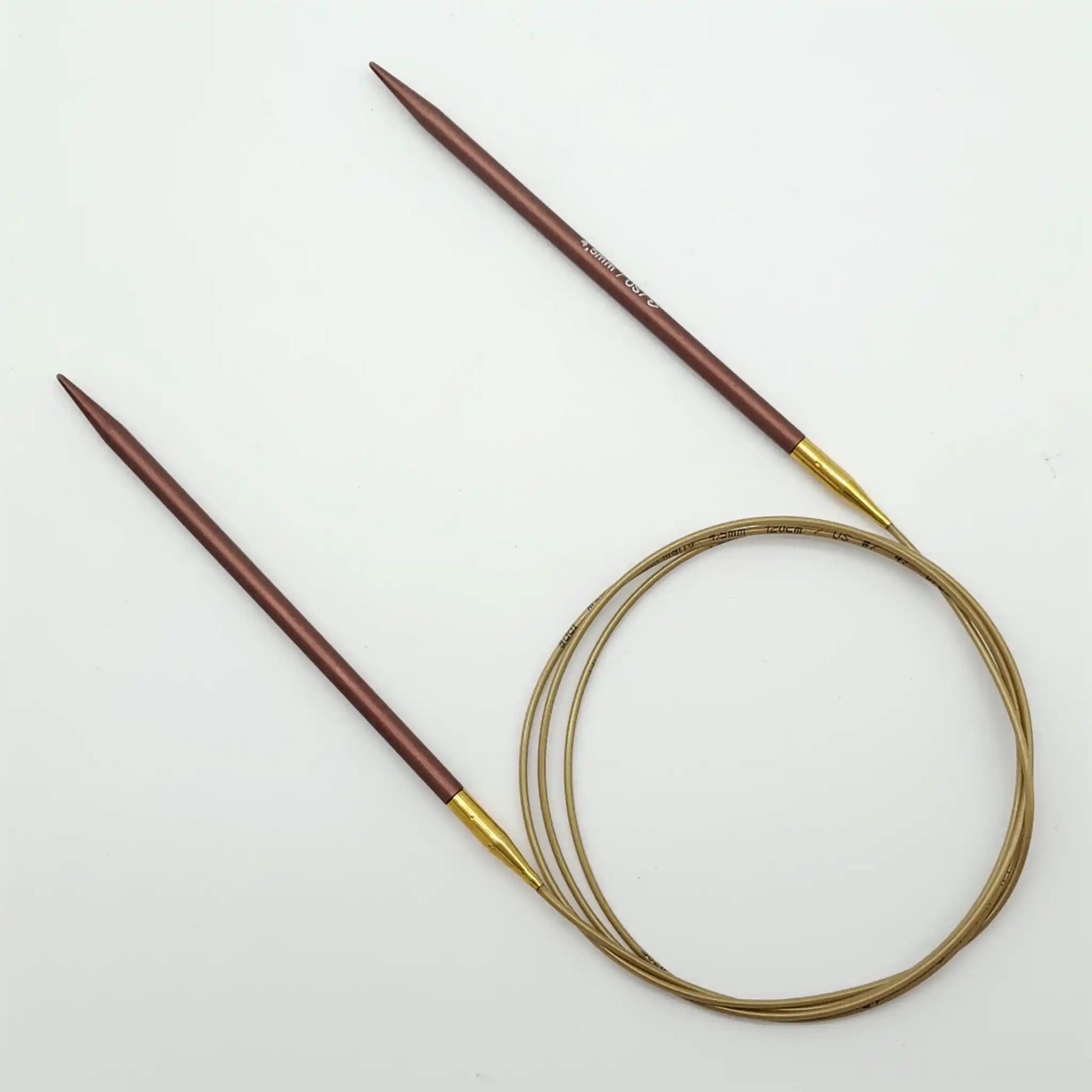 Addi 47in Mystic Rockets with tips and gold cables with brass ferrules on a white background