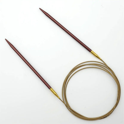 Addi 60in Mystic Rockets with tips and gold cables with brass ferrules on a white background