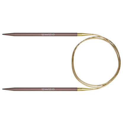 Addi Mystic Rocket Knitting Needles with gold circular cables and anodized purple tips on a white background