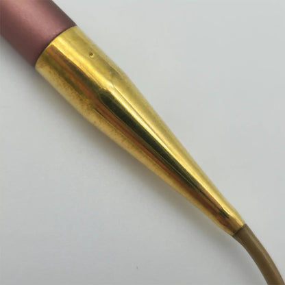 Closeup of the Addi Mystic Rockets Brass Ferrule, showing the crimps and dimple pressings connecting it to the tips