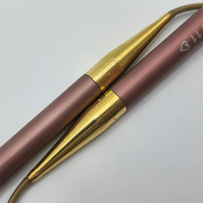 Closeup of the Addi Mystic Rockets, showing the anodized mauve tips fitting into the brass ferrules
