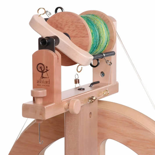 Close-up of the Ashford Kiwi 3 sliding hook flyer, three-speed whorl, scotch tension brake band and threading hook