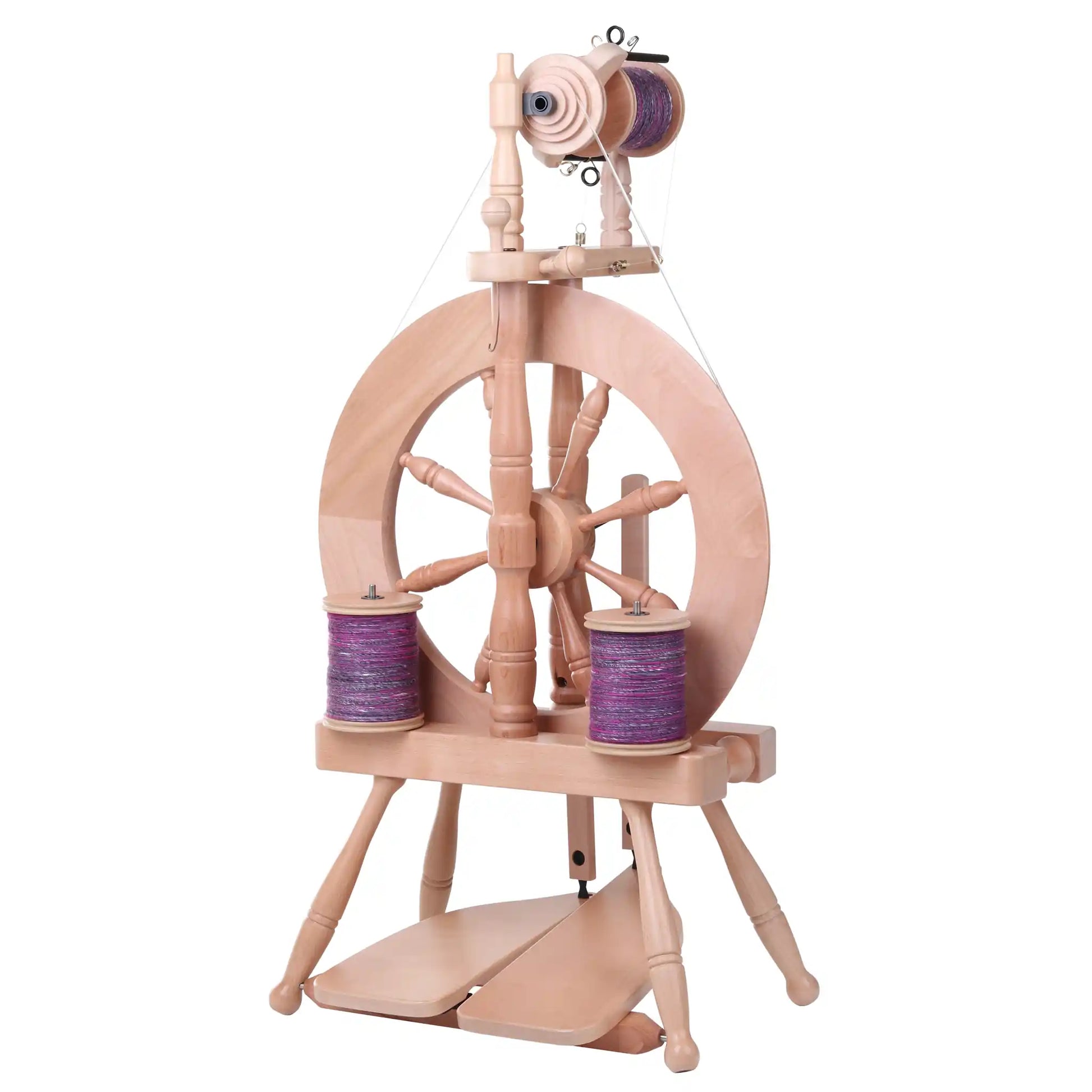 Traveller 3 Spinning Wheel with bobbins full of purple yarn and a lacquered finish