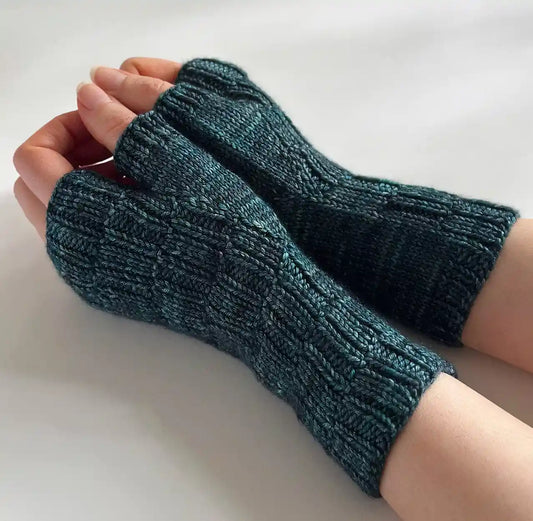Knitted ingredient mitts in a blue color being worn