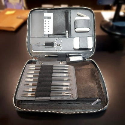 ChiaoGoo Forté 2.0 case open and propped on a wood desk, needle tips and tools ready to use