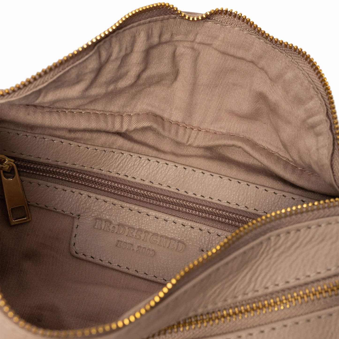 Taupe Faust Bag showing stamped RE:DESIGNED logo inside, and open view of inside