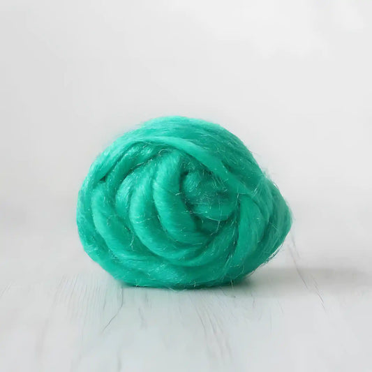 Coil of emerald green Firestar nylon top sparkle fiber by Paradise Fibers