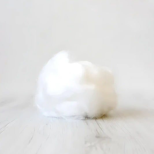 Tuft of natural white undyed Firestar nylon top sparkle fiber by Paradise Fibers