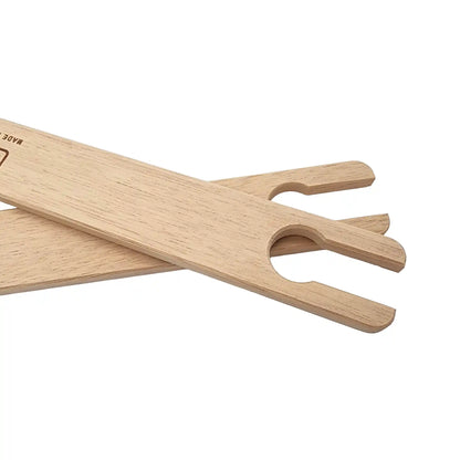 Forked notched end of a Louet beech stick shuttle