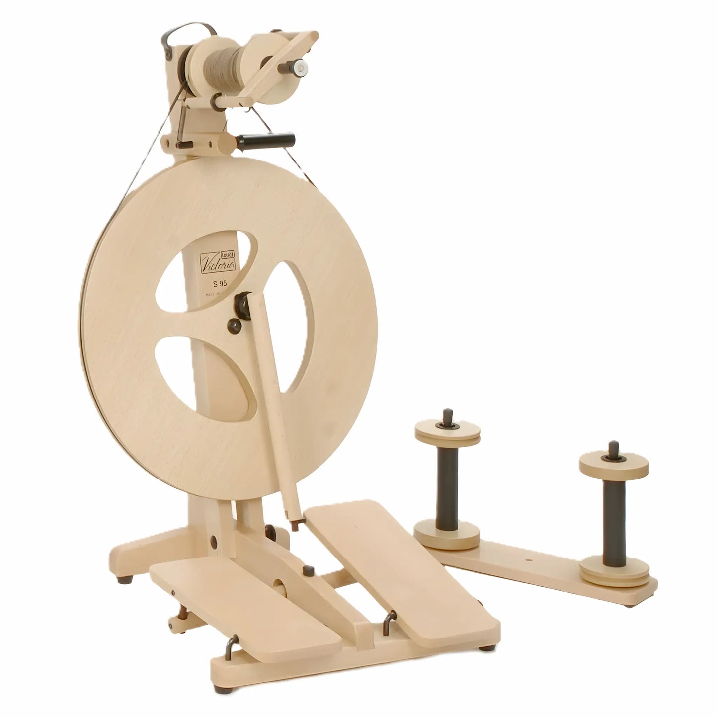 Wooden spinning wheel on a white background