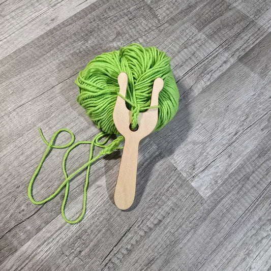 Wild Stitchers Lucet in use making cord