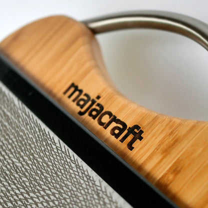 Close-up of Majacraft Blending Board with majacraft engraved on a wooden handle.