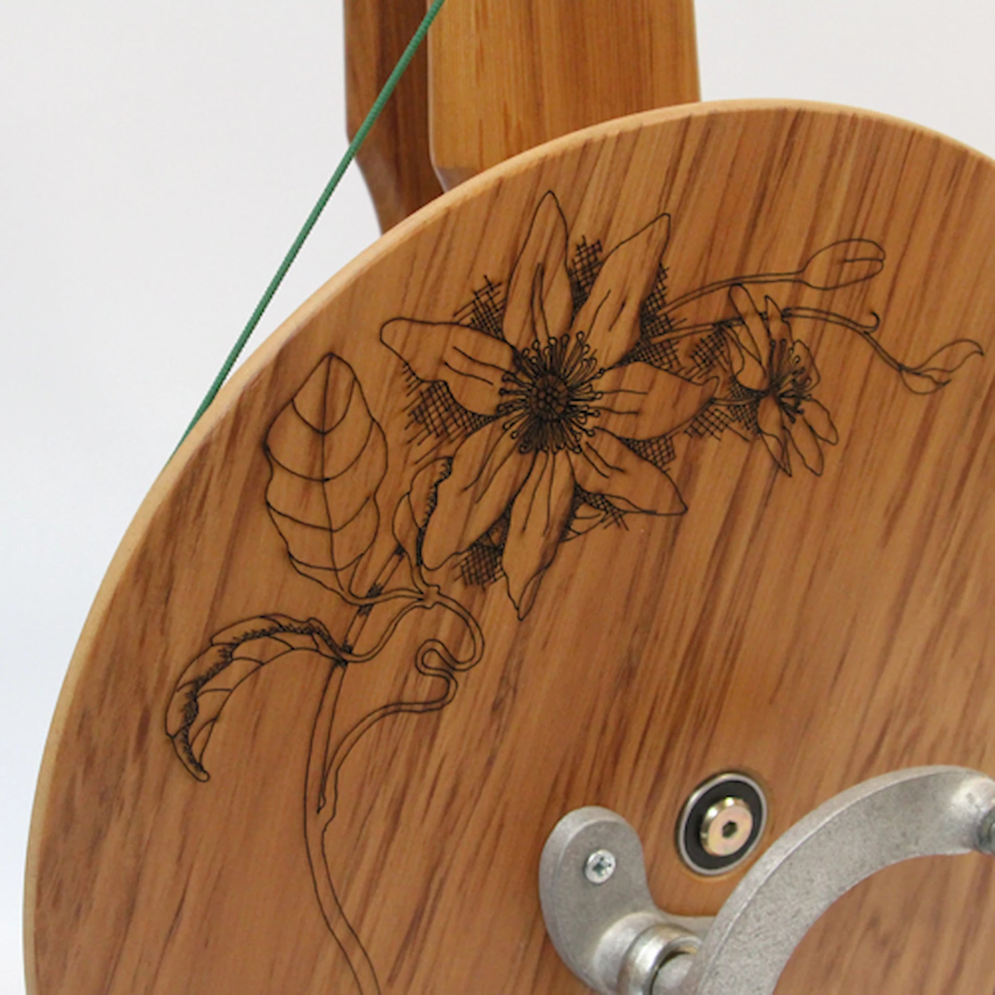 Closeup of the Clematis Flower design on the Majacraft Suzie Spinning Wheel