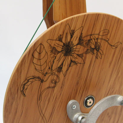 Closeup of the Clematis Flower design on the Majacraft Suzie Spinning Wheel