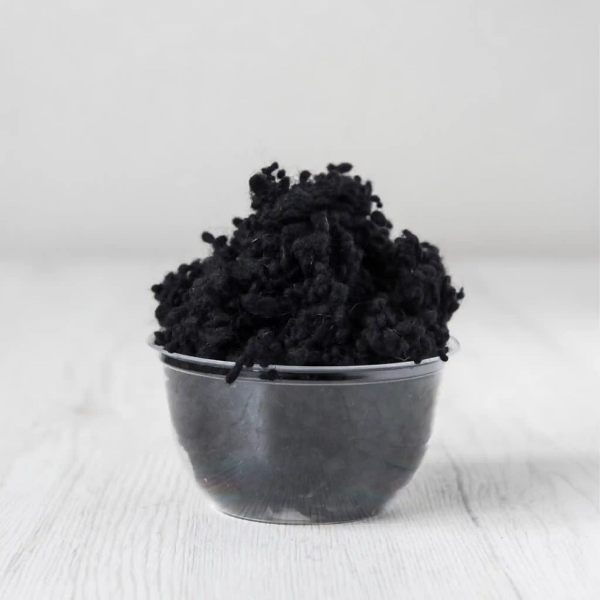 Merino wool nepps in Dark, small entangled fiber balls