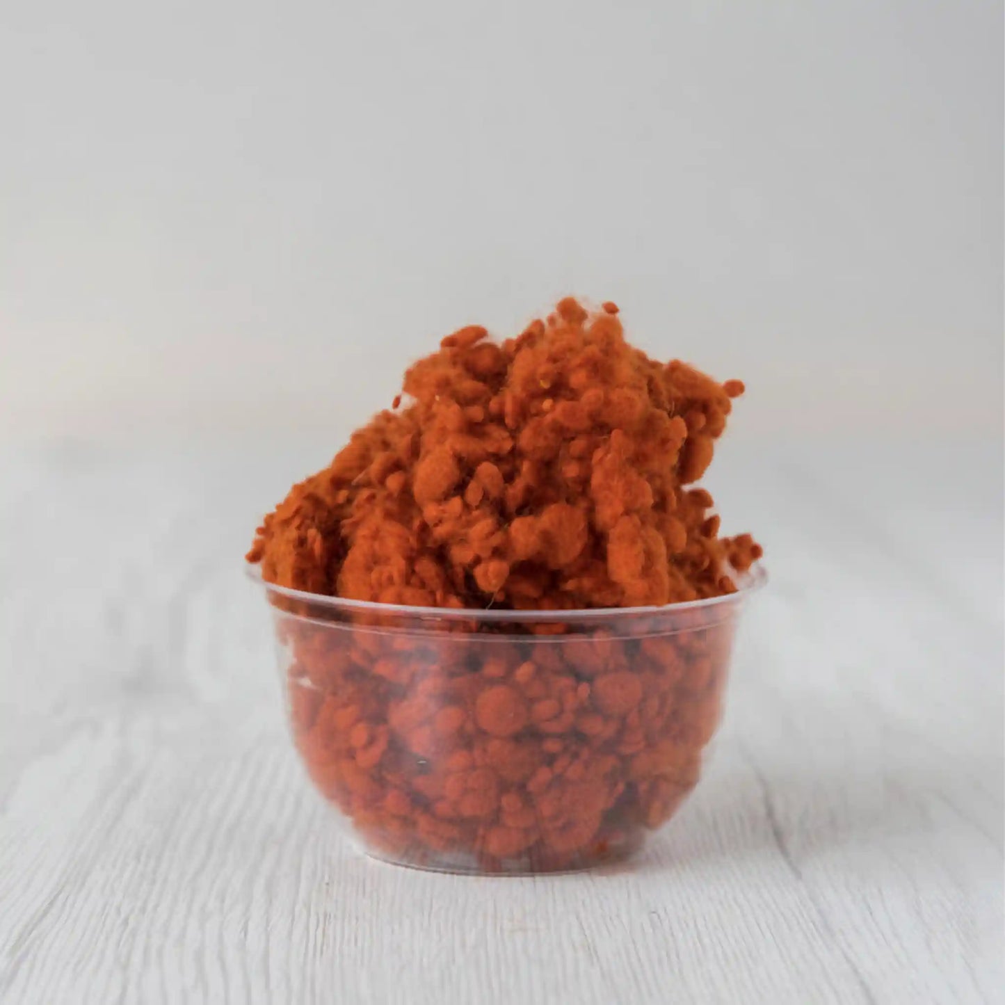 Merino wool nepps in Pumpkin, small entangled fiber balls