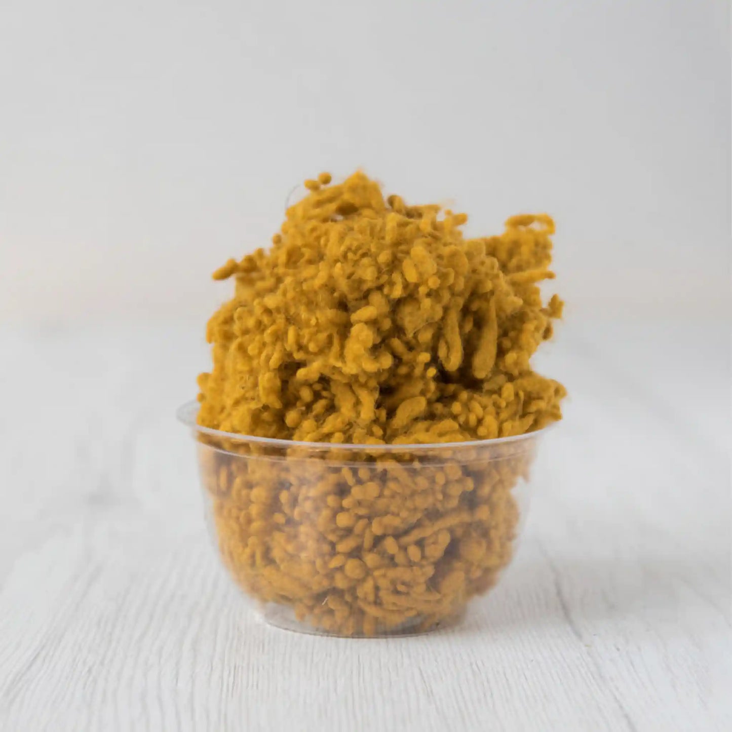 Merino wool nepps in Saffron, small entangled fiber balls