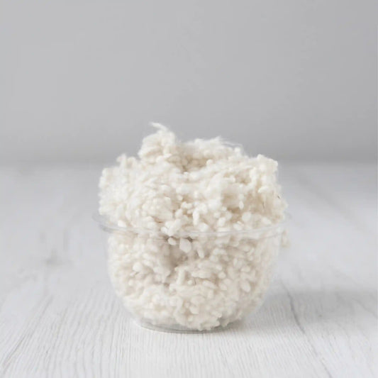 Merino wool nepps in Natural White, small entangled fiber balls