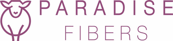 Paradise Fibers Logo using a signature sheep design and purple color