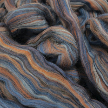 Paradise Fibers Multi-Colored Merino Wool Top in Denim, a blue and rust-orange merino spinning fiber