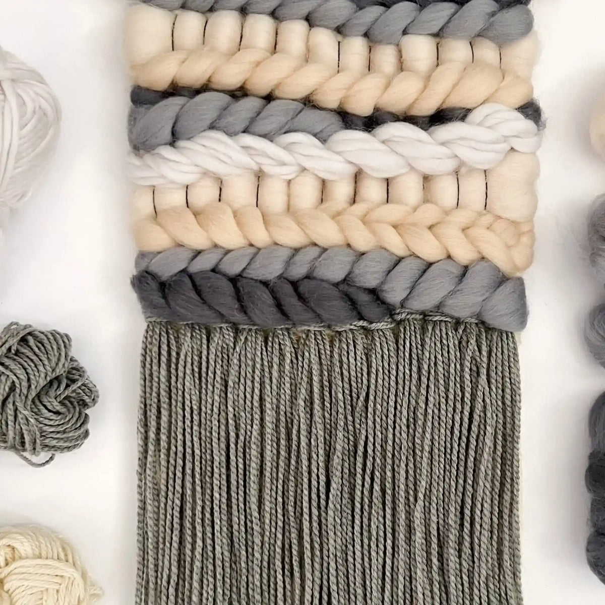 Woven wall hanging made with the Mono Mix palette from the Paradise Fibers Weaver's Collection Mixed Bag - Mono Mix