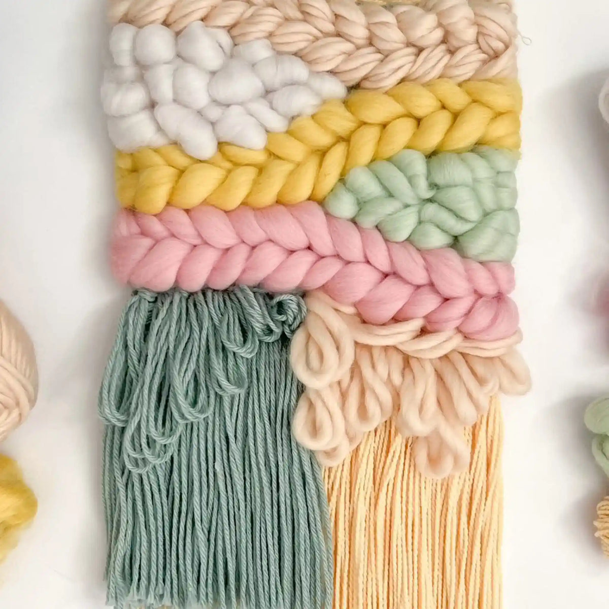 Woven wall hanging made with the Pastel Palette palette from the Paradise Fibers Weaver's Collection Mixed Bag - Pastel Palette