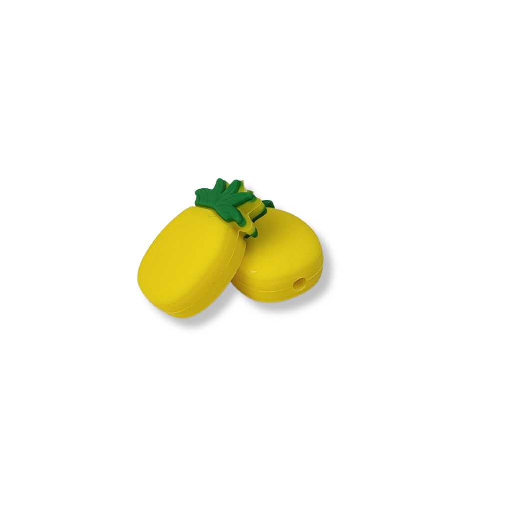 Two yellow pineapple charms