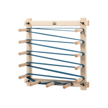 Schacht 4.5 Yard Warping Board shown with blue warp on it against a white background