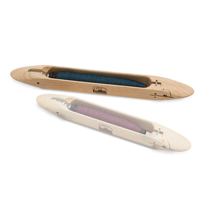 Schacht 15 inch end delivery shuttle loaded with a blue weft pirn
