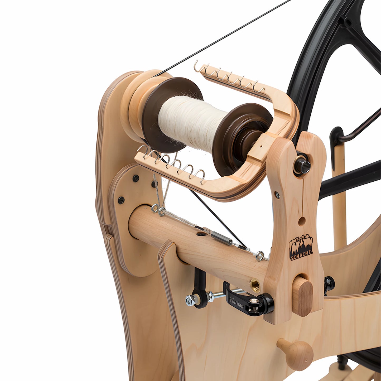 Closeup shot of the Schacht Flatiron Spinning Wheel Flyer and Mother of All
