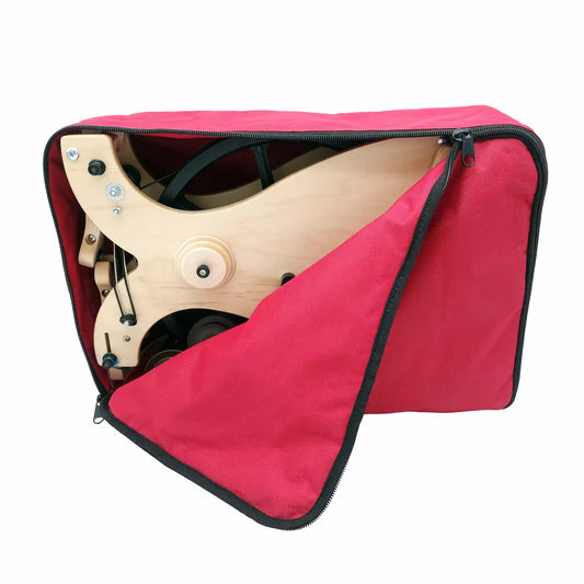 Schacht Sidekick inside a red travel bag, partially open and showing the top half of the wheel