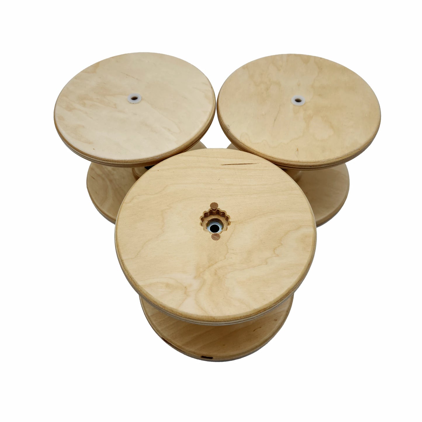 Three SpinOlution 12oz Baltic birch bobbins shown from both ends