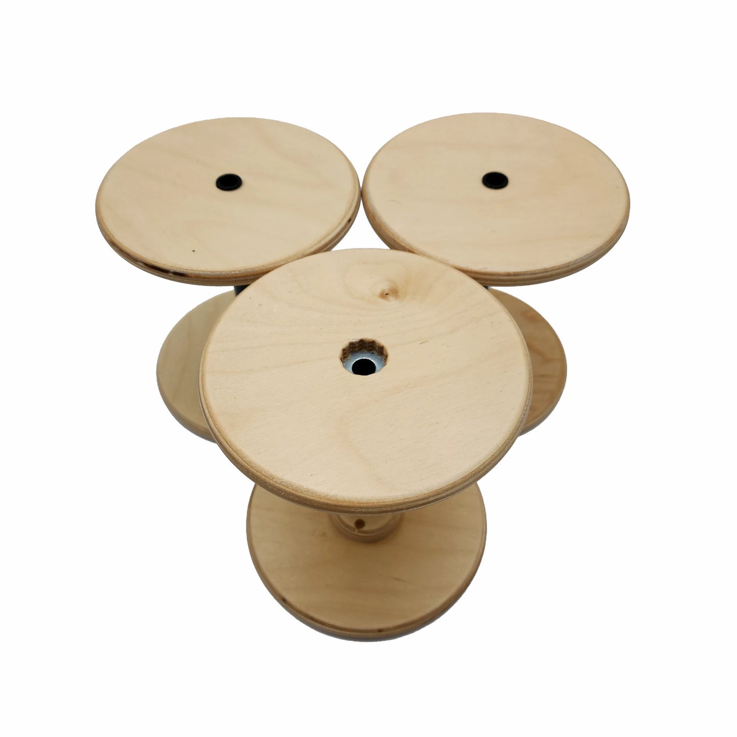 Three SpinOlution 16oz Baltic birch bobbins shown from both ends
