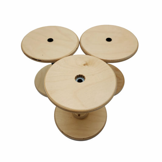 Three SpinOlution 16oz Baltic birch bobbins shown from both ends